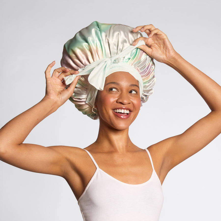 Model wearing KITSCH Aura Oversized Satin Bonnet — lifestyle shot — worn while sleeping to protect hair overnight