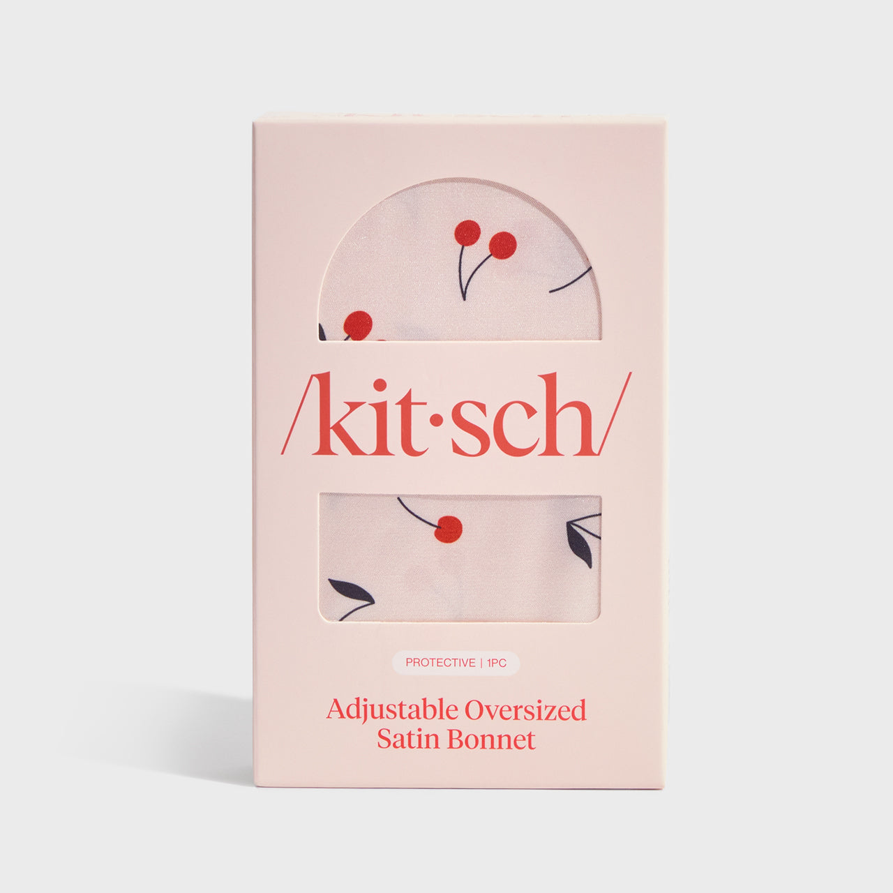 KITSCH Cherry Print Oversized Satin Bonnet — packaging shot — adjustable, double-layered satin, cherry print