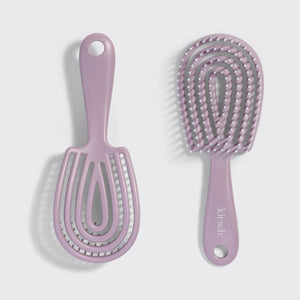 KITSCH Soft Violet Detangling Flexi Brush - Mini — model using the brush on hair — Bendable Bristles: adapts to the shape of your head for a comfortable and effortless detangling experience — gliding smoothly through tangles