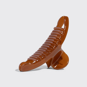 Side view of kitsch translucent Mocha Arched Claw Clip - Large showing curved teeth and hinge