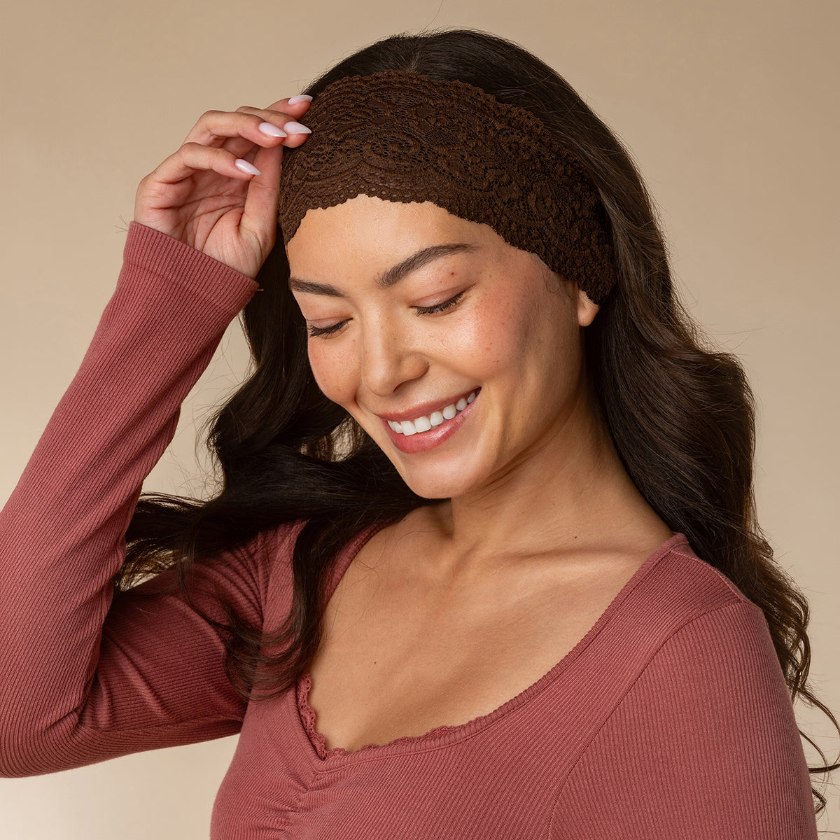 KITSCH Mocha & Chocolate Wide Lace Headbands 2pc Set — model adjusting the chocolate lace headband at her hairline — flexible fit moves with you from day to night — day-to-night styling
