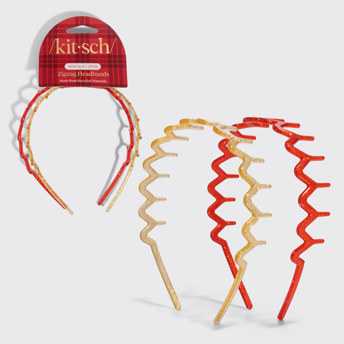 KITSCH Gold & Red Zig Zag Headbands 2pc Set — gold and red glitter zigzag headbands shown on and beside the red plaid Kitsch packaging card — Keeps hair comfortably away from the face — holiday outfits and everyday looks