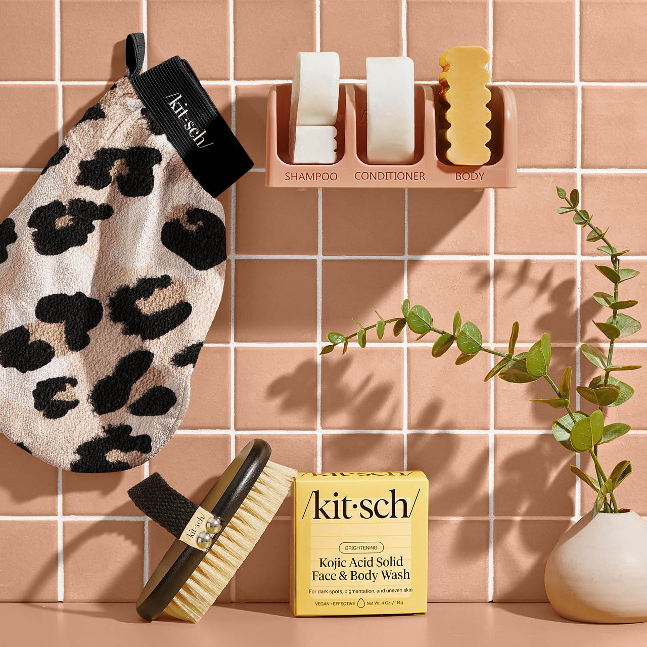 Kitsch Leopard Exfoliating Glove shown together with other Cleanse and body care products in a creative group shot