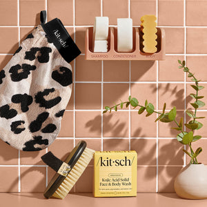 Kitsch Leopard Exfoliating Glove shown together with other Cleanse and body care products in a creative group shot