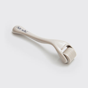 KITSCH Warm Gray Micro Derma Roller — detail shot of the micro-needle roller head — 0.25mm stainless steel micro-needle technology — engineered for controlled, even coverage