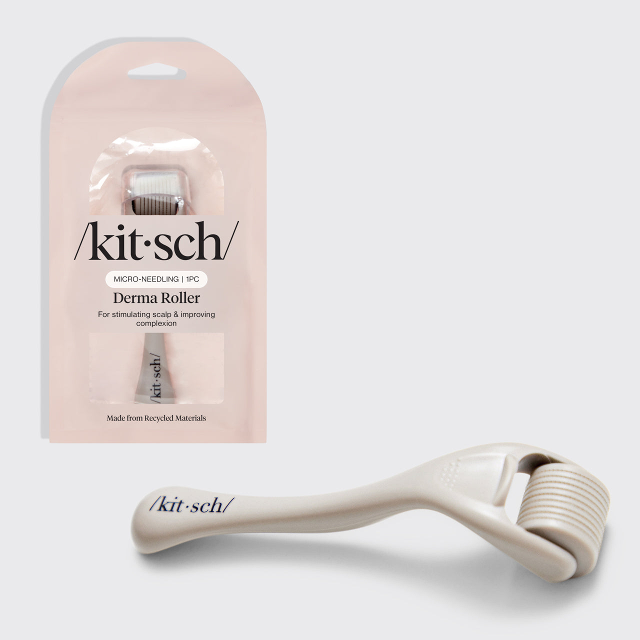 KITSCH Warm Gray Micro Derma Roller — hero product shot — Increases absorption of oils, serums, and moisturizers — shown unpackaged beside its retail packaging for at-home use