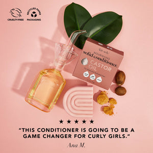 kitsch castor oil solid conditioner bar with a bottle of castor oil on a pink background. There is a Leaping Bunny badge and a Recycle paper packaging badge in the upper left corner. On the bottom of the image is a 5 star customer review that says "this conditioner is going to be a game changer for curly girls"