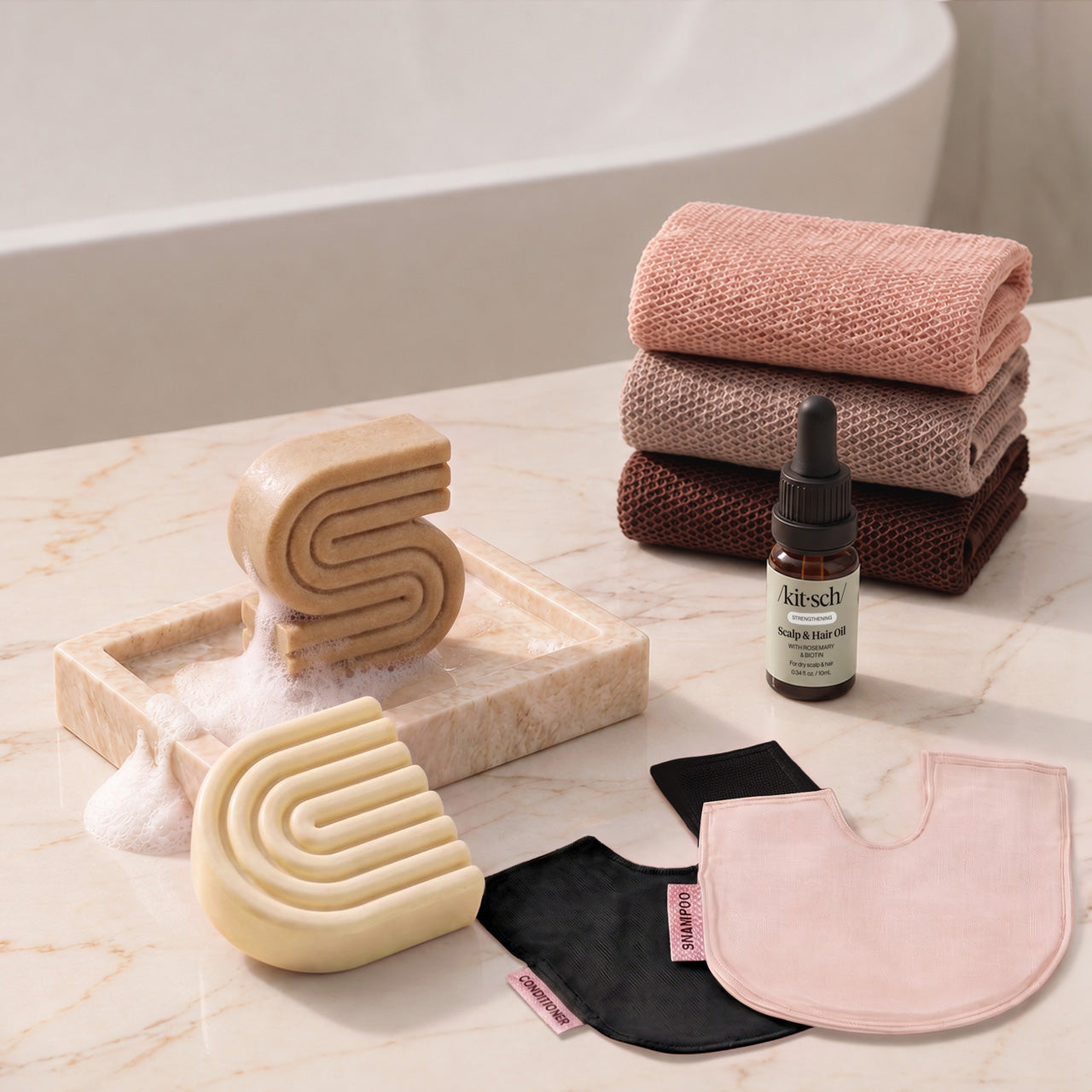 Coconut Oil: Kitsch Winter Welcome Kit with Coconut Oil shampoo and conditioner bars, Rosewood African Net Sponge, shampoo and conditioner bar bags, and Rosemary & Biotin Scalp & Hair Oil.