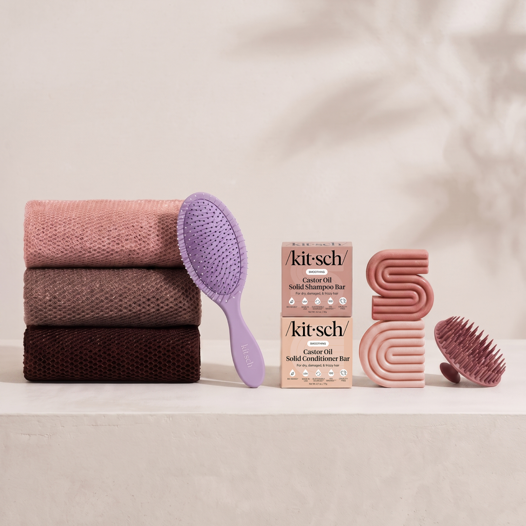 Kitsch Spring Welcome Kit Castor Oil shown as a full bundle with the Nourishing Castor Oil Shampoo and Conditioner Bars, Soft Violet Wet/Dry Brush, Terracotta Scalp Exfoliator and Rosewood African Net Sponge on a soft neutral background