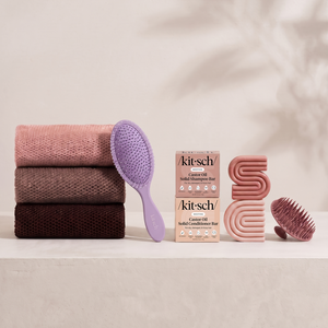 Kitsch Spring Welcome Kit Castor Oil shown as a full bundle with the Nourishing Castor Oil Shampoo and Conditioner Bars, Soft Violet Wet/Dry Brush, Terracotta Scalp Exfoliator and Rosewood African Net Sponge on a soft neutral background